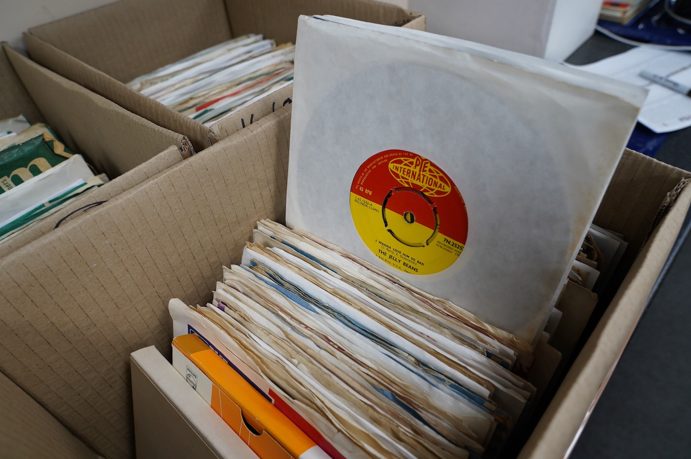 Three boxes of 7” singles on Parlophone and Pye labels, artists including; The Sweet, Orange Bicycle, the Beatles, Matt Monro, The Marcels, The Righteous Brothers, Chuck Berry, etc. Condition - fair